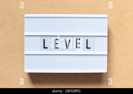 White lightbox with word level on wood background Stock Photo