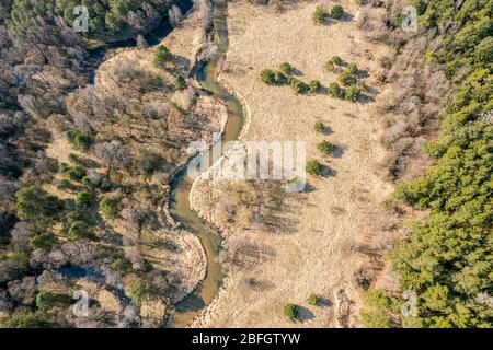 winding river flow through the valley. spring landscape at sunny day. aerial view Stock Photo