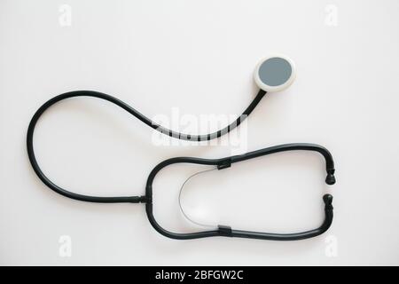 Black stethoscope isolated on white background. Healthcare Stock Photo