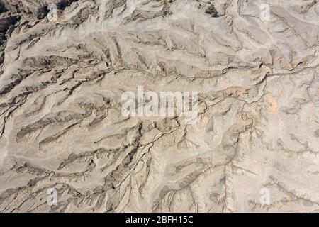 Aerial view of volcanic sand, dust and old lava flows at the 'sea of sand', Mount Bromo, Java. Stock Photo