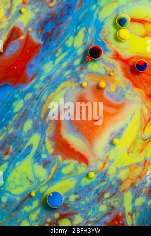 Colorful artistic background with various colors mixed with oil and milk Stock Photo