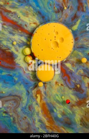 Colorful artistic background with various colors mixed with oil and milk Stock Photo