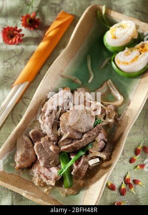 slices of pork meat sauteed in garlic sauce. japanese cuisine Stock Photo