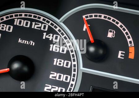 Close up shot of a speed meter and fuel gage in a car Stock Photo