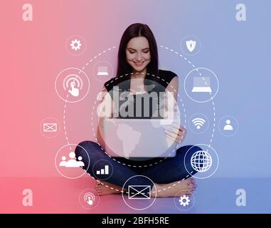Woman using personal computer with flying network Stock Photo