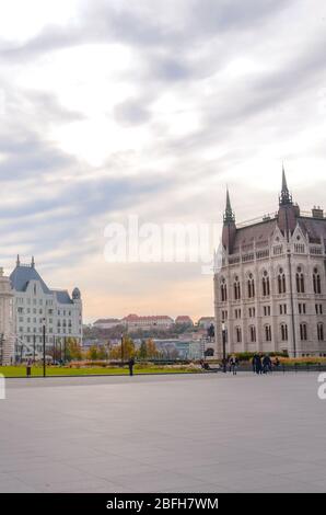 Budapest, Hungary - Nov 6, 2019: Empty Kossuth square with the building of Hungarian Parliament Orszaghaz. Historical buildings in the background. Vertical photo. Stock Photo