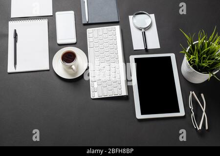Top view of workplace with digital devices Stock Photo