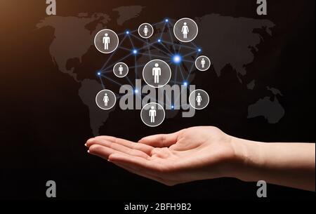 Social connections in hand. Dual screen with world map Stock Photo