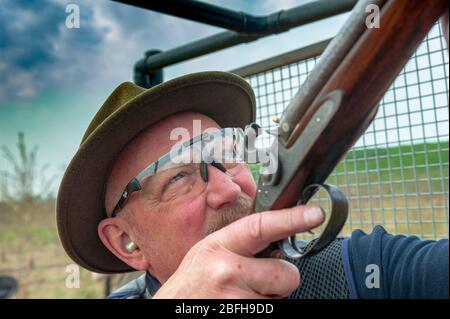 A gent firing a 200 year old muzzle loading black powder shotgun at