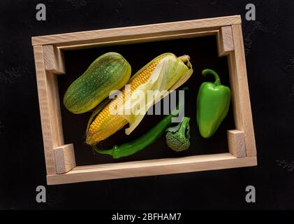Fresh peppers in wooden box vegetables in eco wooden box Stock Photo