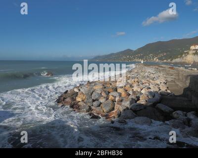 Stone pier view in Camogli, seastorm view from stone pier, landscape view Stock Photo