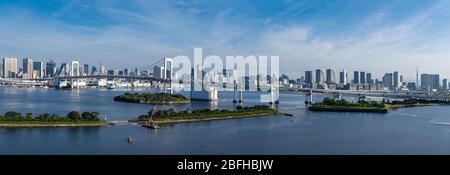 Panorama Aerial view of Tokyo skylines with Rainbow bridge and tokyo tower over Tokyo bay in daytime from Odaiba in Tokyo city Kanto Japan. Stock Photo