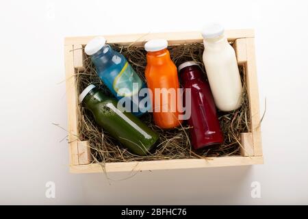 Set of healthy colored detox drinks in wooden box Stock Photo