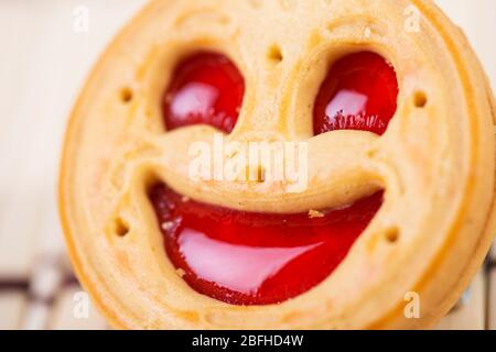 smiling strawberry jam cookies. Close up photo Stock Photo