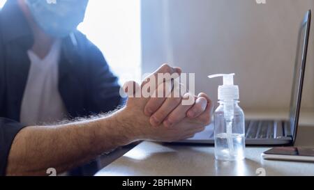 Unrecognizable Man Using Sanitizer Disinfecting Hands Before Work, Panorama, Cropped Stock Photo