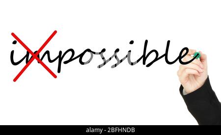 Human hand turning word impossible into possible Stock Photo