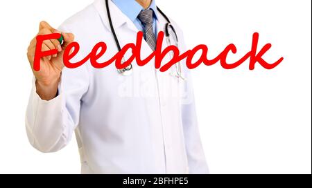 Doctor writing word Feedback on transparent board Stock Photo