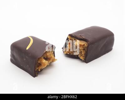 London, 2020 – A Handmade Dark Chocolate And Cobnut Bar Isolated On A White Back Ground. Stock Photo