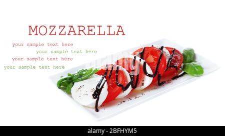 Caprese salad on plate, isolated on white Stock Photo