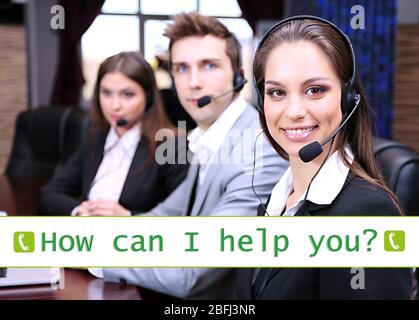 Call center operators and How can I help you? text Stock Photo
