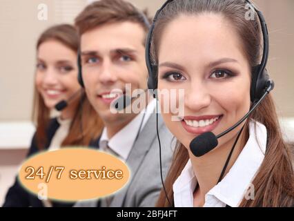 Call center operators at office, Round-the-clock support concept Stock Photo