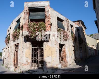 Damaged house in the center of Vukovar, Croatia with bullet impacts. The city was the center of 1991-1995 conflict between Serbia & Croatia, damaging Stock Photo