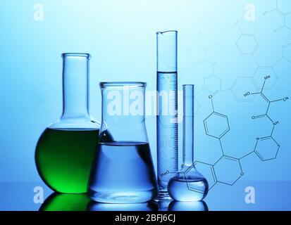 Test tubes with liquid on blue background Stock Photo