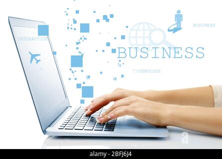 Businesswoman using laptop with digital layer effect on background Stock Photo
