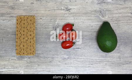 Food, Breakfast, sandwich. Tomatoes, avocado, bread, toast. Ingredients, cook. Vegan, vegetarian, proper nutrition. Stock Photo