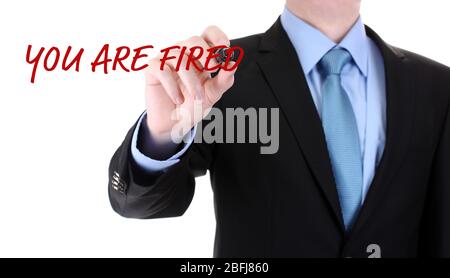 Businessman writing You are fired on screen isolated on white Stock Photo