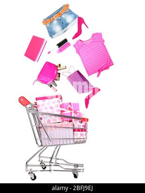 Goods falling into cart isolated on white Stock Photo