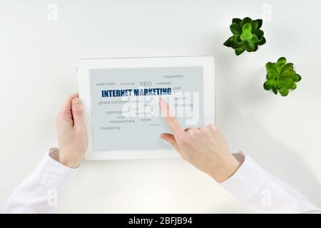 Word cloud in tablet. Internet marketing concept Stock Photo