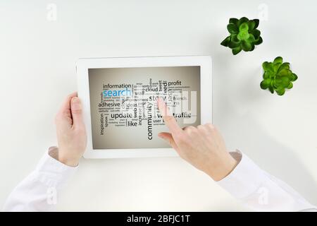 Word cloud in tablet. Search concept Stock Photo