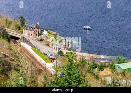 View down to village Stromeferry with railway station on Loch Carron in Highland Scotland UK from A890 above Stock Photo