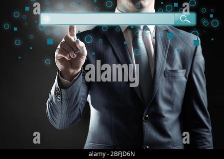 Technology, searching system and internet concept. Businessman hand pressing Search button Stock Photo