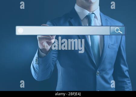 Technology, searching system and internet concept. Businessman hand pressing Search button Stock Photo