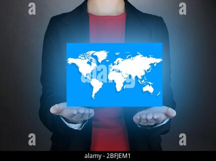 Female hands showing earth globe on dark background Stock Photo