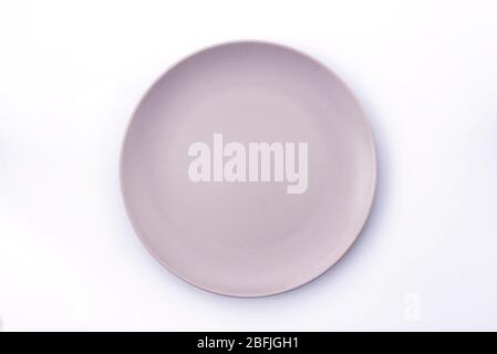 Empty Pale Purple plate isolated on white background top view Stock Photo