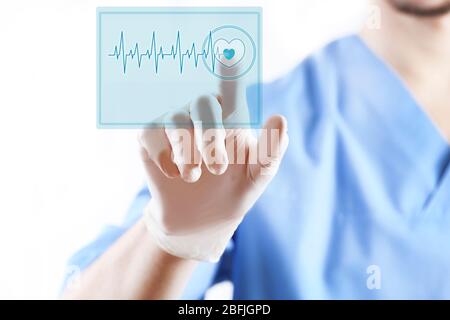 Cardiac Building Button doctor pressing virtual button with heart diagram Stock Photo - Alamy