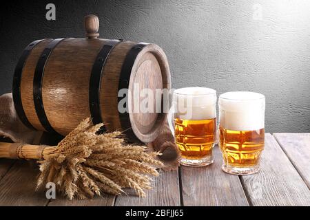 Beer barrel with beer glasses on table Stock Photo