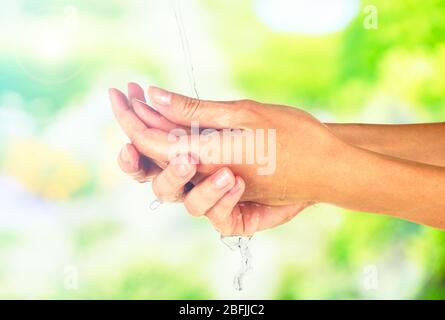 Washing hands on nature background Stock Photo