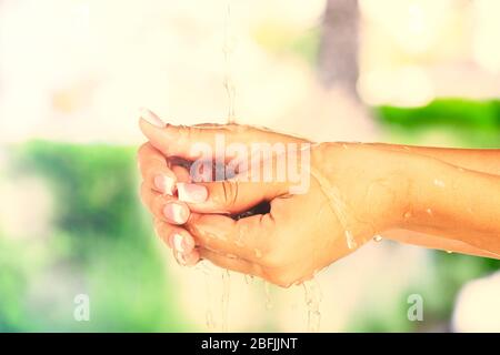 Washing hands on nature background Stock Photo