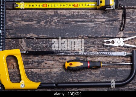 old carpentry tools on wooden background Stock Photo