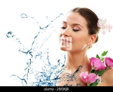 Beautiful young woman and water splash isolated on white Stock Photo