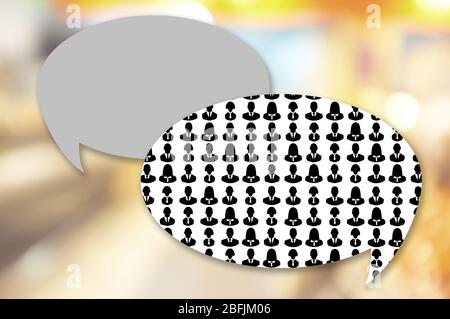 Silhouettes of business people in speech bubble on bright background Stock Photo