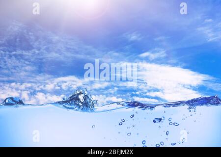 Water waves on sky background Stock Photo