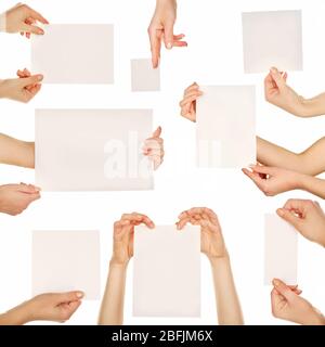Hands holding blank cards isolated on white Stock Photo