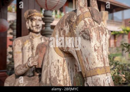 Kochi, Kerala, India - April 5, 2018:  Old wooden sculpture of a horse and its rider in the historical district of Kochi, with no people, India Stock Photo