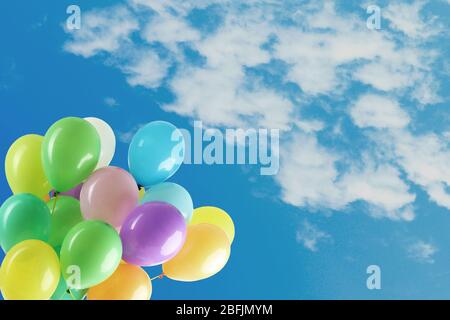 Colorful balloons on blue sky Stock Photo