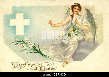 Easter Greetings card, with winged Angel,  Easter Lillies and a White Cross. c.1915.  To see my other holiday images -- Search words:  Prestor  vintage  Holiday Stock Photo